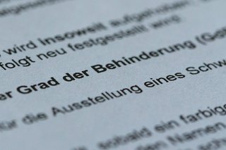 Ausschnitt aus einem Feststellungsbescheid, in dem der Grad der Behinderung mitgeteilt wird. 