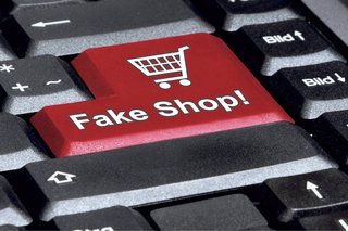 Das Bild zeigt den Ausschnitt einer Tastatur mit der Taste „Fake Shop!“